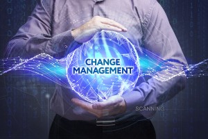 Business Technology Internet and network concept. Young businessman shows the word: Change management